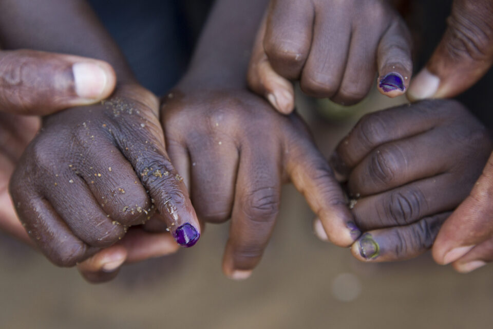 Picture of children's fingers being marked to show they have gotten the polio vaccine